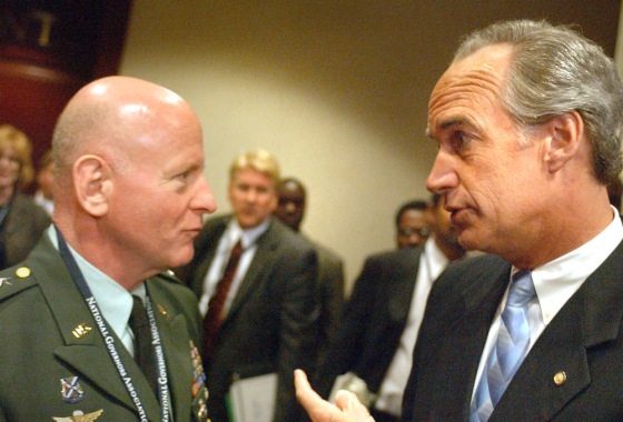 Chief of the National Guard Lt. Gen. H. Steven Blum talks Sunday with Governors Association chairman and Idaho Gov. Dirk Kempthorne at the National Governors Association Meeting in Washington.