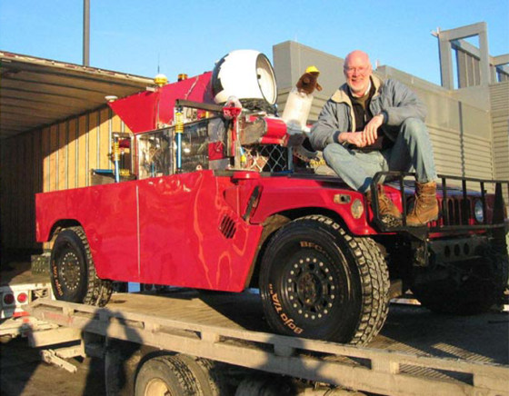 Red Team leader William "Red" Whittaker sits on Sandstorm, the Carnegie Mellon-based team's entry in the DARPA Grand Challenge race. Sandstorm is equipped with an autonomous guidance system designed for a 300-mile trip.