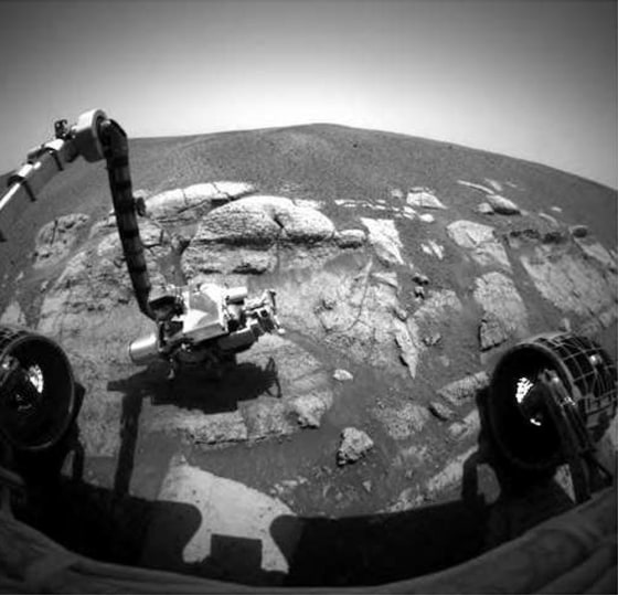 The latest picture from the Opportunity rover's front hazard avoidance camera shows the probe's robotic arm setting scientific instruments down on a rock named El Capitan.