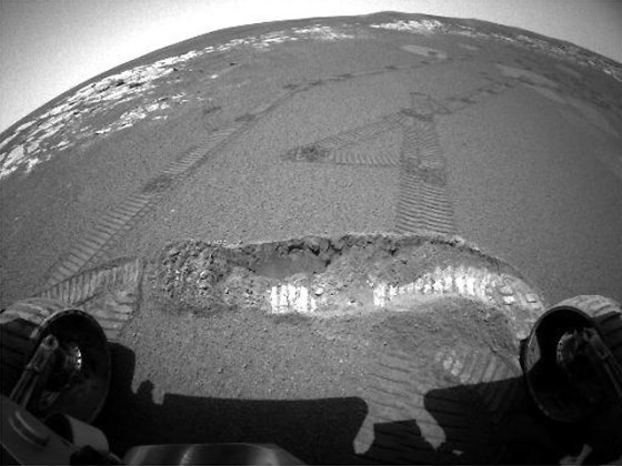 A wide-angle view taken by the Opportunity rover's hazard avoidance camera last month shows a trench dug in Martian dirt. Some scientists say the rover tracks suggest that the soil contains brine, with permafrost beneath the surface.