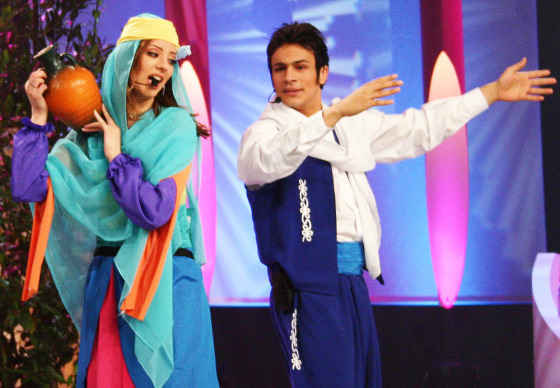 Student Bahaa al-Kafi of Tunisia, left, and Mohammed Attiyah of Egypt, right, sing during a live show of the "Star Academy" program in the Lebanese town of Adma, last Friday. The program is one of the first reality TV shows to air in the Arab World.