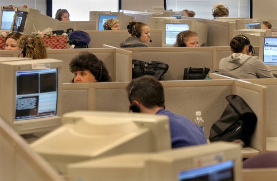 Workers answer phones at the Travelocity call center in Clintwood, Va. The center and its jobs are set to be phased out by year's end.