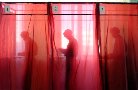 Russian soldiers cast their ballots in Moscow on Sunday in a presidential election that incumbent Vladimir Putin won easily.