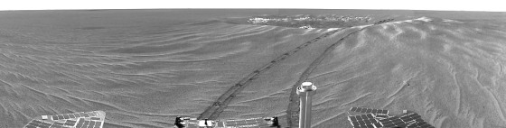 NASA's Opportunity rover takes its first panoramic image looking back at the crater where it landed.