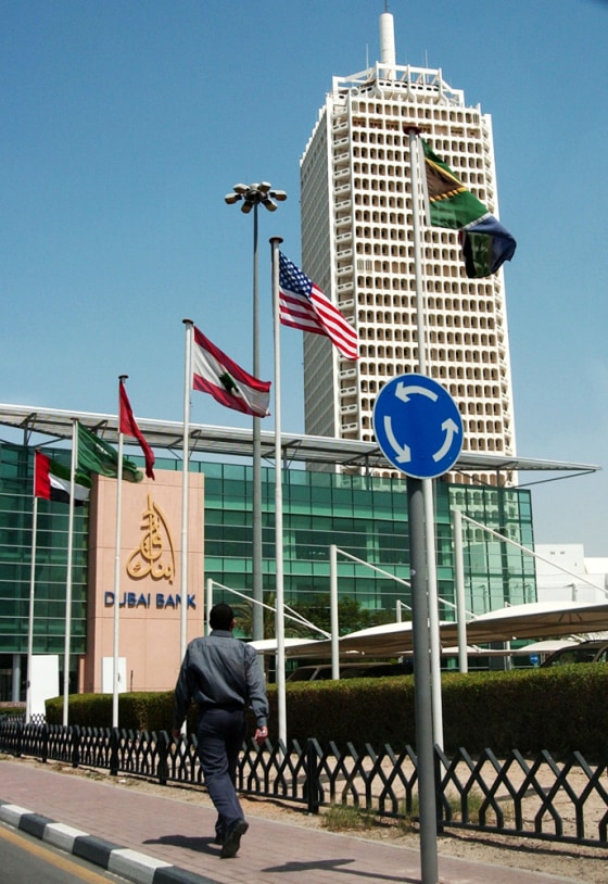 A man passes by the World Trade Center Tower which houses the U.S. Consulate in Dubai, United Arab Emirates, on Wednesday, after both the consulate and the U.S. Embassy in Abu Dhabi were temporarily closed.