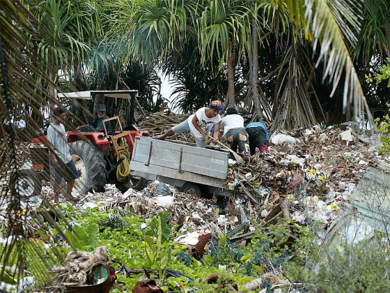 Domestic garbage is used to reinforce the sea wall against the rising sea on Funafuti Atoll, home to nearly half of Tuvalu's entire population of 11,500.