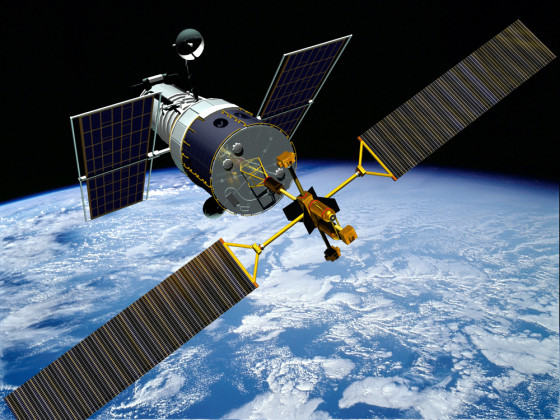 In this artist's conception, Orbital Recovery's ConeXPress space tug docks with the Hubble Space Telescope. Orbital Recovery's scheme is one of several proposed for boosting or servicing the telescope.