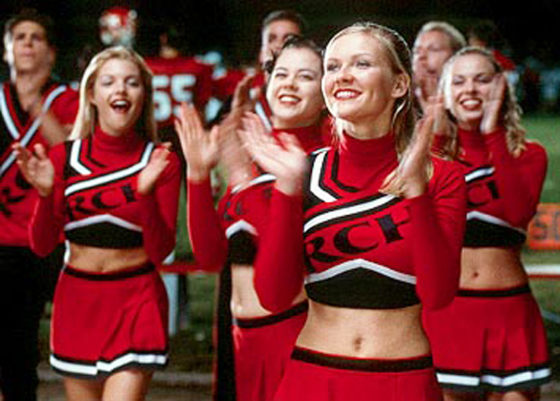 Actress Kirsten Dunst, foreground, is seen leading her cheerleading squad during the NBC Universal film "Bring It On." The movie's choreographer is a consultant on THQ's new cheerleading video game.