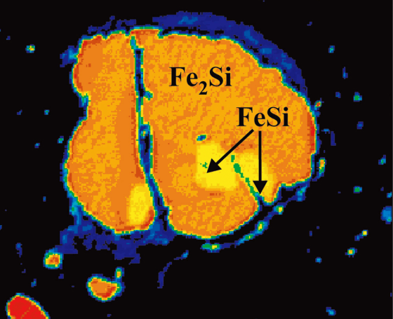 A backscatter electron image shows the newly discovered mineral, known as hapkeite or Fe2Si, in orange. Another type of mineral, FeSi, is indicated as yellow.