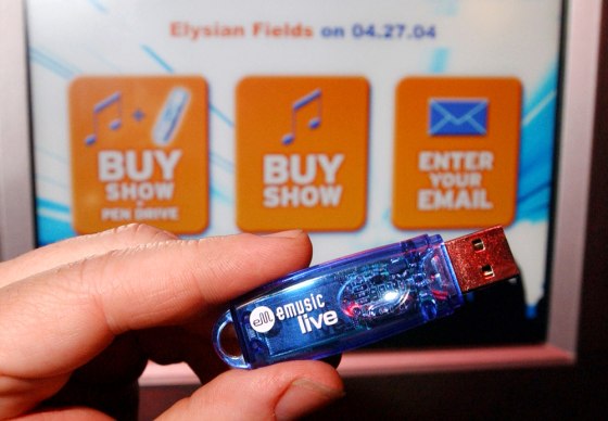 An eMusicLive USB pen drive and live music kiosk are shown in New York on April 27. Users can now load a live recording of a show onto a cigarette-lighter-sized hard-drive that can hang off a keychain.