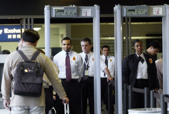 Transportation Security Administration screeners await a passenger at Los Angeles International Airport.