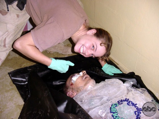 In this undated photo, obtained by ABC News and allegedly taken by Sgt. Charles Frederick in Abu Ghraib prison in Baghdad, Iraq, Army Spc. Sabrina Harman of the 372nd Military Police Company poses with the body of a dead Iraqi man packed in ice.