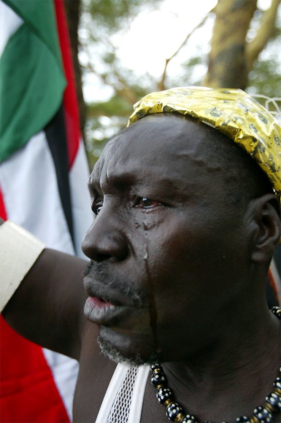 A Sudanese man cries Wednesday as he waits for the signing of the last three protocols between the Sudanese goverment and Sudan People's Liberation Army in Naivasha, Kenya.