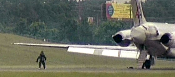 A suspicious package is removed from the cargo of an American Airlines flight that made an emergency landing in Nashville on its way from Dallas to Boston Wednesday evening.