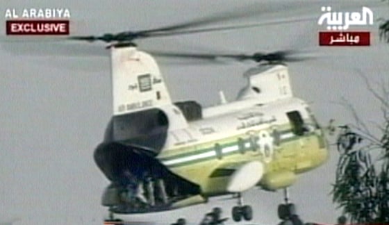 Al-Arabiya TV showed a helicopter unloading Saudi security forces onto the roof of the building where militants were holding hostages Sunday.