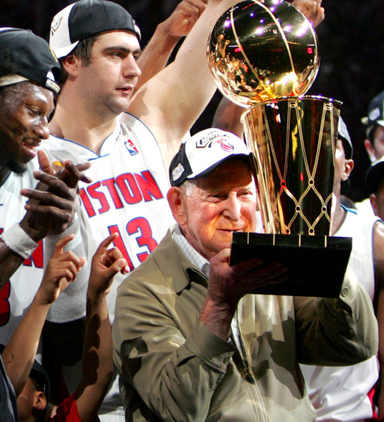 PISTONS OWNER WILLIAM DAVIDSON CELEBRATES WITH LARRY OBRIEN TROPHY