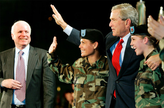 US PRESIDENT BUSH WAVES WITH US MILITARY PERSONNEL AT FT LEWIS