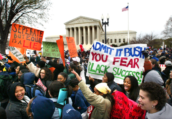 Students demonstrate outside the Supreme Court as it debated on April 1, 2003 in Washington whether colleges and universities could legally consider race when admitting students.