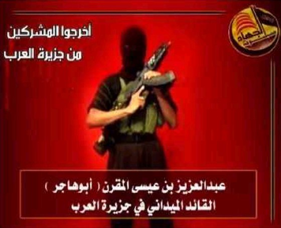 IMAGE TAKEN FROM AN ISLAMIST WEB SITE SHOWS HOODED MAN PURPORTED TO BE SAUDI AL QAEDA LEADER ABDUL AZIZ AL-MUQRIN MAKING A STATEMENT