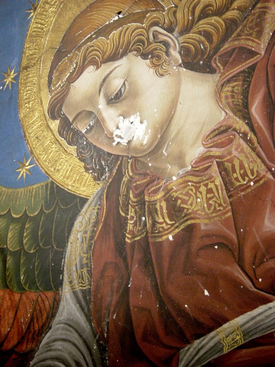 A partial view of a Renaissance fresco, found by an art restoration team, shows an angel's head, surrounded by a halo and stars. The work of art, thought to have been painted by Francisco Pagano and Pablo de San Leocadio in 1481, was found during repairs of Valencia's cathedral.