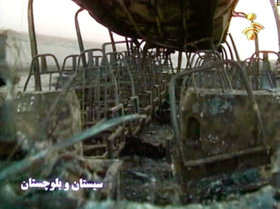 The charred interior of a bus is seen on Friday after a tanker truck full of gasoline crashed into a line of public buses on the highway between Bam and Zahedan, in southeast Iran.