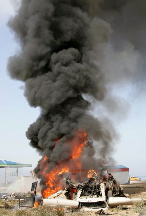 A vehicle allegedly used by Palestinian militants burns in Gaza after being hit by an Israeli airstrike on Thursday.