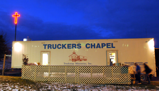 Truckers file into a mobile chapel at truckstop in Kingdom City, Mo., on March 21.