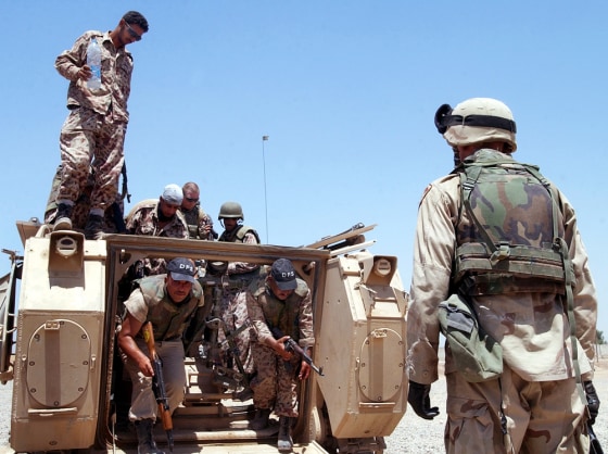 A U.S. Army soldier and members of the Iraqi Civil Defense Corps,&nbsp;return from a joint patrol in Baghdad on Tuesday.