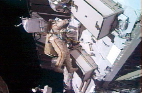 Russian cosmonaut Gennady Padalka makes repairs on the exterior of the international space station Wednesday.