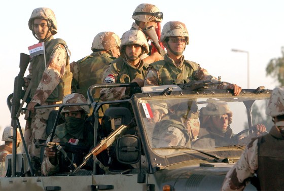 Iraqi National Guard soldiers head out on an evening patrol from Camp Victory near Baghdad Thursday.