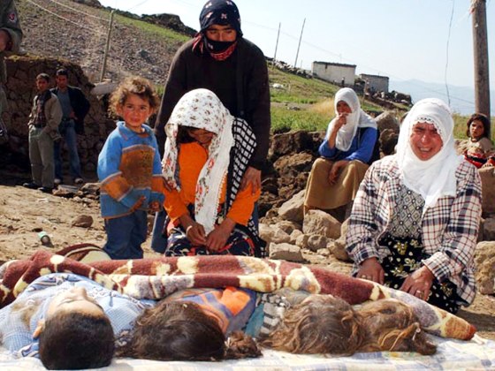 Turkish women mourn over their children killed in an earthquake in the village of Yigincal, eastern Turkey, early Friday.