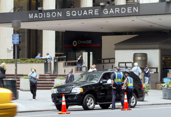 New York City Police officers talk to a motorist at a checkpoint at the Seventh Avenue entrance to New York's Pennsylvania Station and Madison Square Garden, Friday, June 25, 2004. Cars entering the restricted area surrounding the Republican National Convention, including those carrying delegates and dignitaries, will be screened for explosives and other contraband by devices that provide real-time video images of their undercarriages. (AP Photo/Ed Bailey)