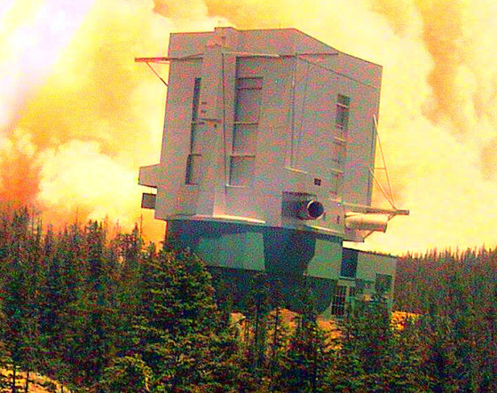 In this image from video, smoke and flames draw near to the Large Binocular Telescope atop Mount Graham near Safford, Ariz., on Saturday.