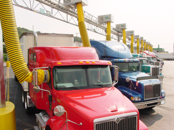 Trucks at the Petro Travel Center in Knoxville, Tenn., get their power and air/heat from yellow ducts that connect to windows.