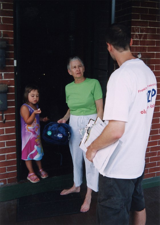 Mark Rutkus, right, of the Franklin County Democratic Party meets Linda Houston and her granddaughter.