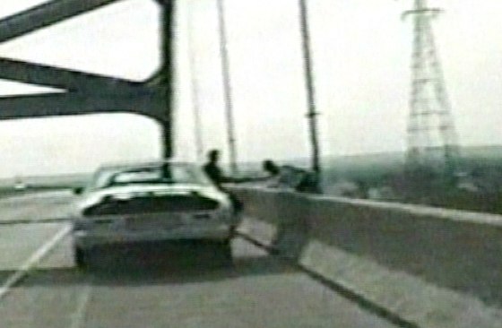 A Wisconsin state trooper grabs a woman seconds after she got out of her car and attempted to jump off a bridge.