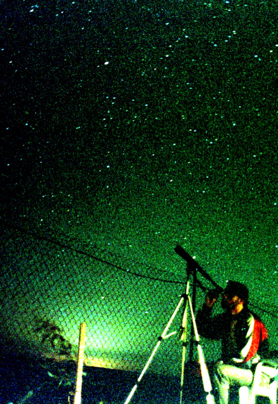 MAN OBSERVES PERSEID METEORS IN THE EASTERN DESERT OF JORDAN