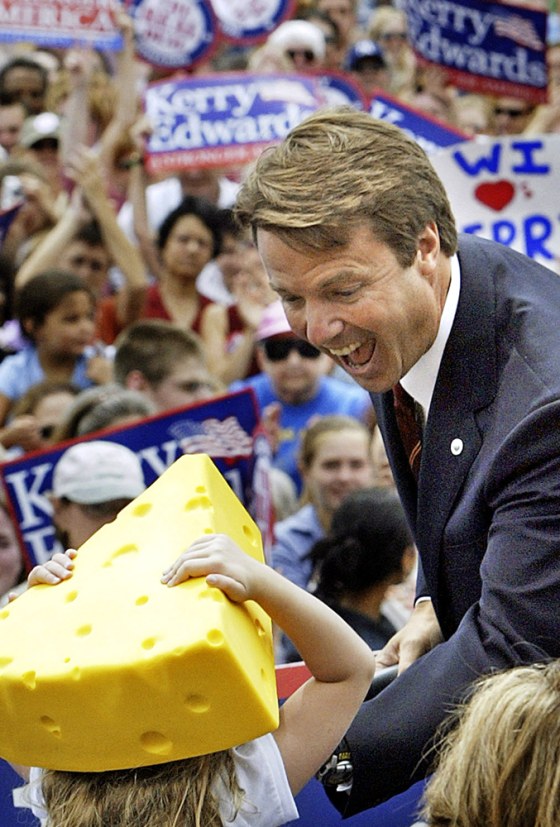 Edwards, joined here in Milwaukee by his daughter Emma Claire in the "cheesehead," is having a little trouble with his voice.