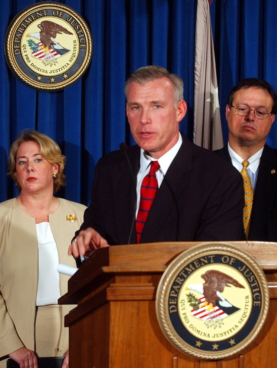 U.S. Attorney David Kelley speaks as Pasquale D'Amuro, assistant director of the FBI, right, and Linda Thomsen, left, the deputy enforcement director of the SEC, look on during a news conference Tuesday in New York to announce the filing of charges.