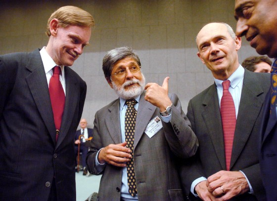 Trade representatives talk before a head of delegations meeting at the WTO headquarters in Geneva