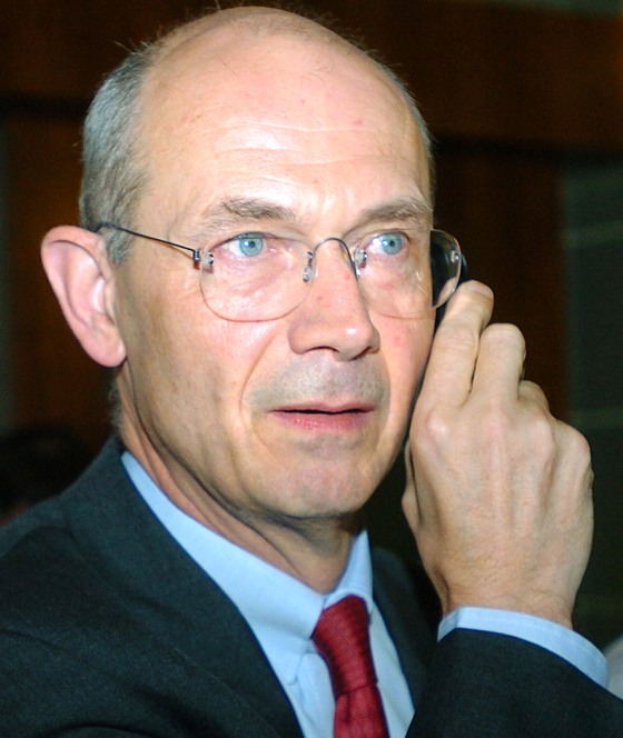 EU Trade Commissioner Pascal Lamy talks on a mobile phone at his arrival at the WTO'Geneva headquarters