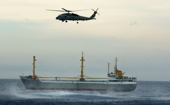 An SH-60B Seahawk helicopter hovers over a merchant vessel Saturday in the Caribbean, as a U.S. Navy team boards for an exercise to search for explosives as part of the joint operation Panamax 2004, a simulated terrorist attack on the Panama Canal.