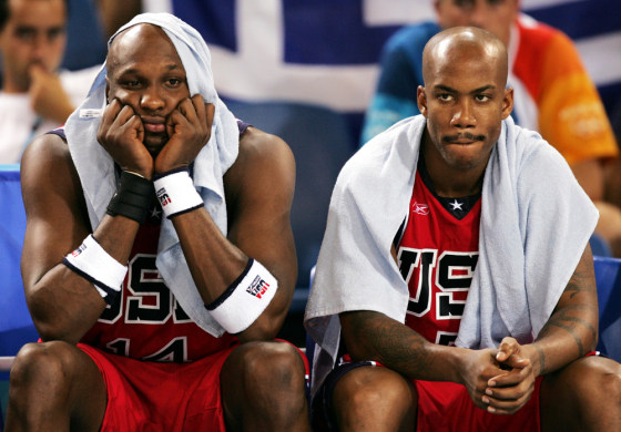 United States men's basketball players Lamar Odom, left, and Stephon Marbury sit dejected as their team loses to Puerto Rico on Sunday.