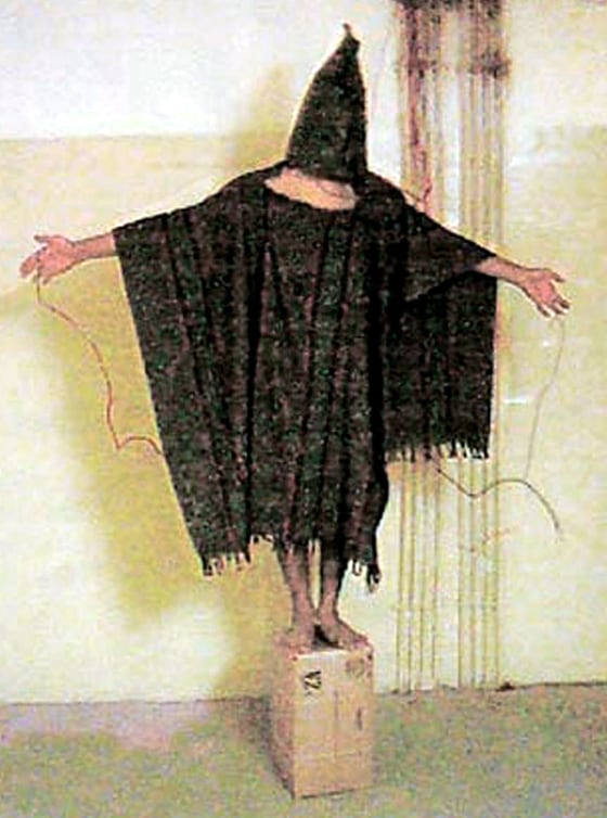 HOODED IRAQI PRISONER IN PHOTOGRAPH COURTESY OF THE NEW YORKER