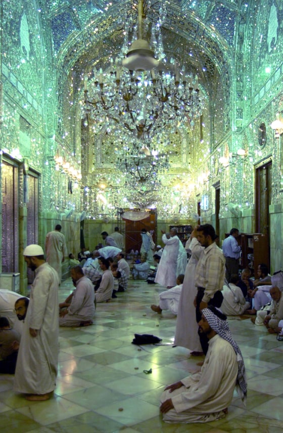 Iraqis pray inside the Holy Shrine of Imam Ali in Najaf on July 14.