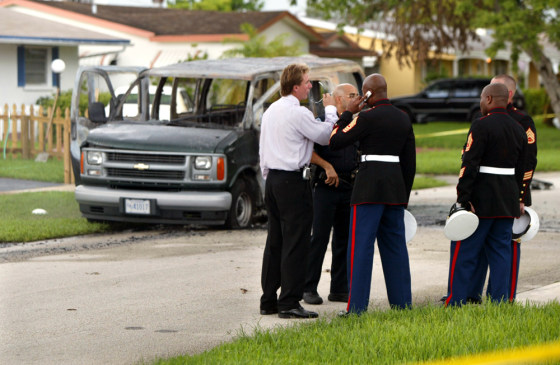 Police and Marines talked Wednesday near the&nbsp;Hollywood, Fla., home where&nbsp;Carlos Arredondo set himself on fire inside the Marine van in the background.