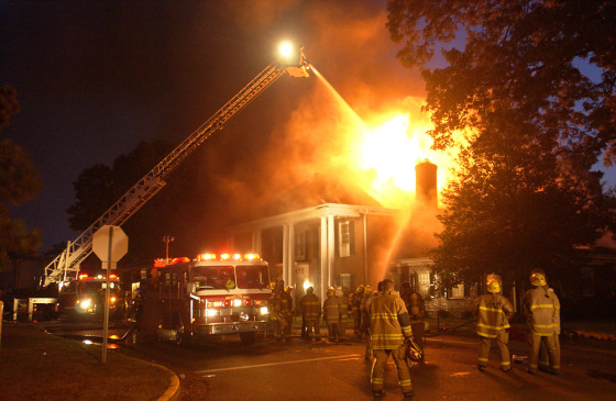 Firefighters fight a fire at the Alpha Tau Omega Fraternity House on the University of Mississippi campus, Aug. 27.