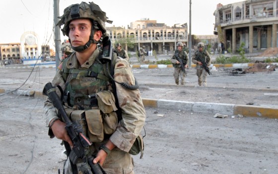 U.S. Army soldiers withdraw from central Najaf&nbsp;to the outskirts of the city after a peace deal was reached Friday.