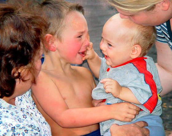 Kenneth Gerken, 3, is reunited on Sunday with his younger brother, Zackery, 9 months, at a campsite near Missoula, Mont.