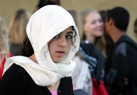 A student wearing Islamic headscarf arrives at start of school year in northern France
